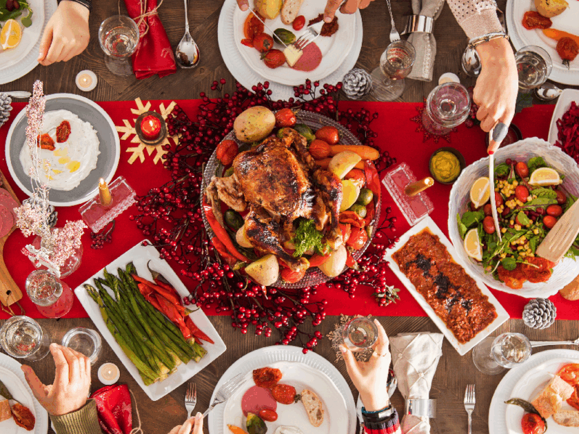 Healthy holiday table with traditional dishes and Christmas decorations