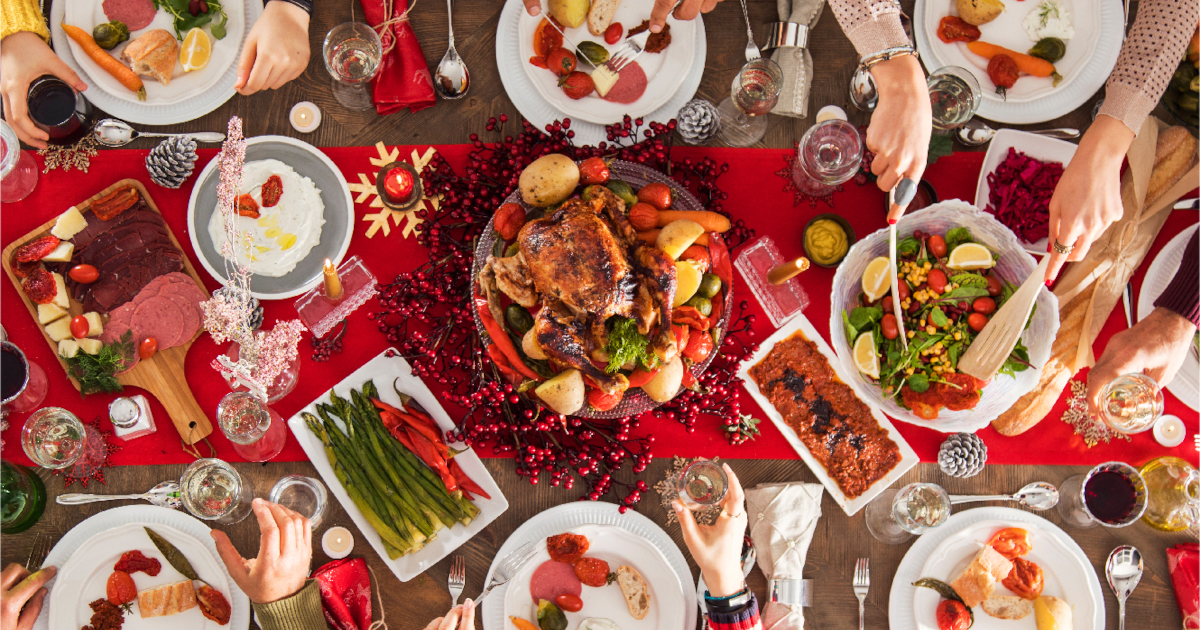 Healthy holiday table with traditional dishes and Christmas decorations